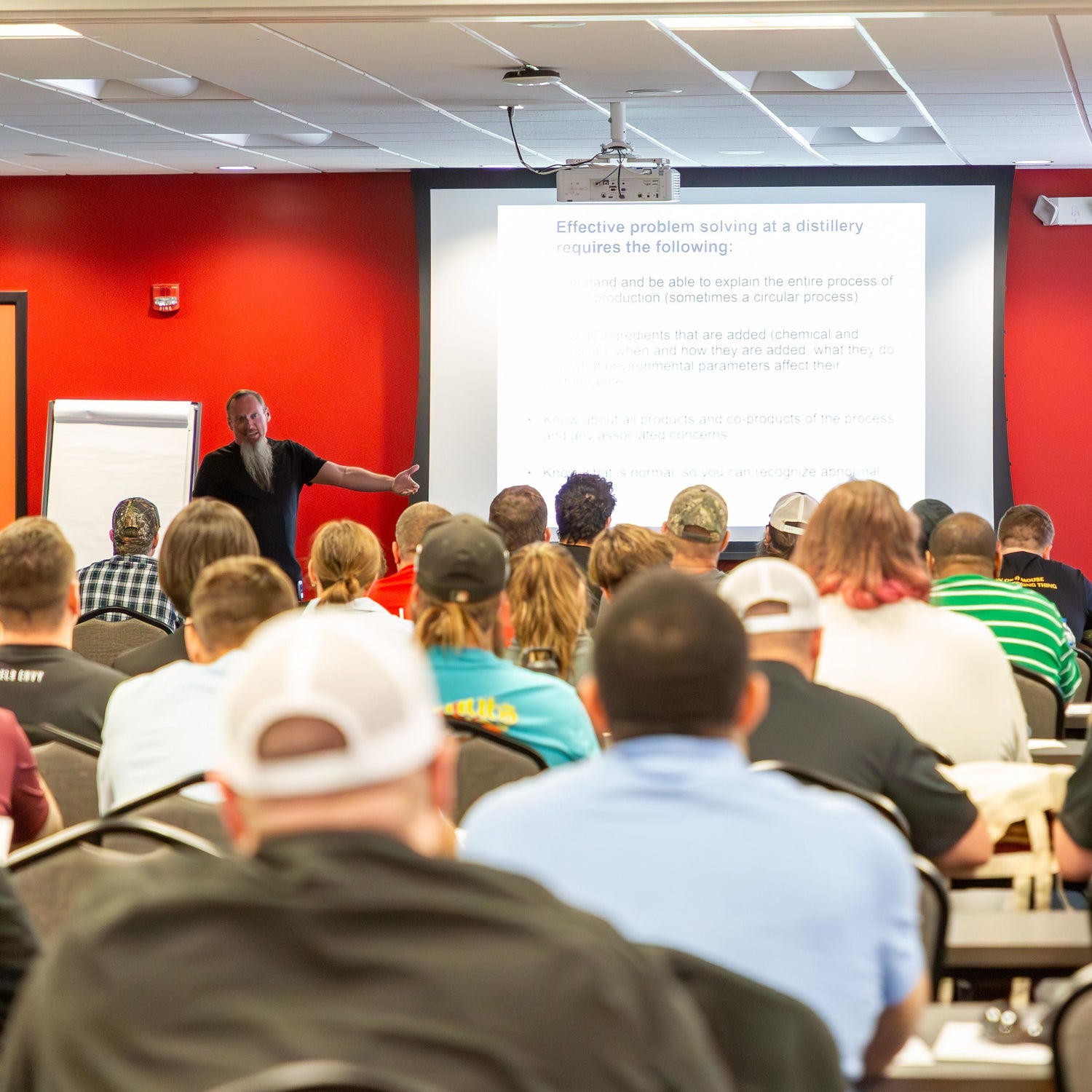 Dr. Pat Heist teaching a class on distillery management
