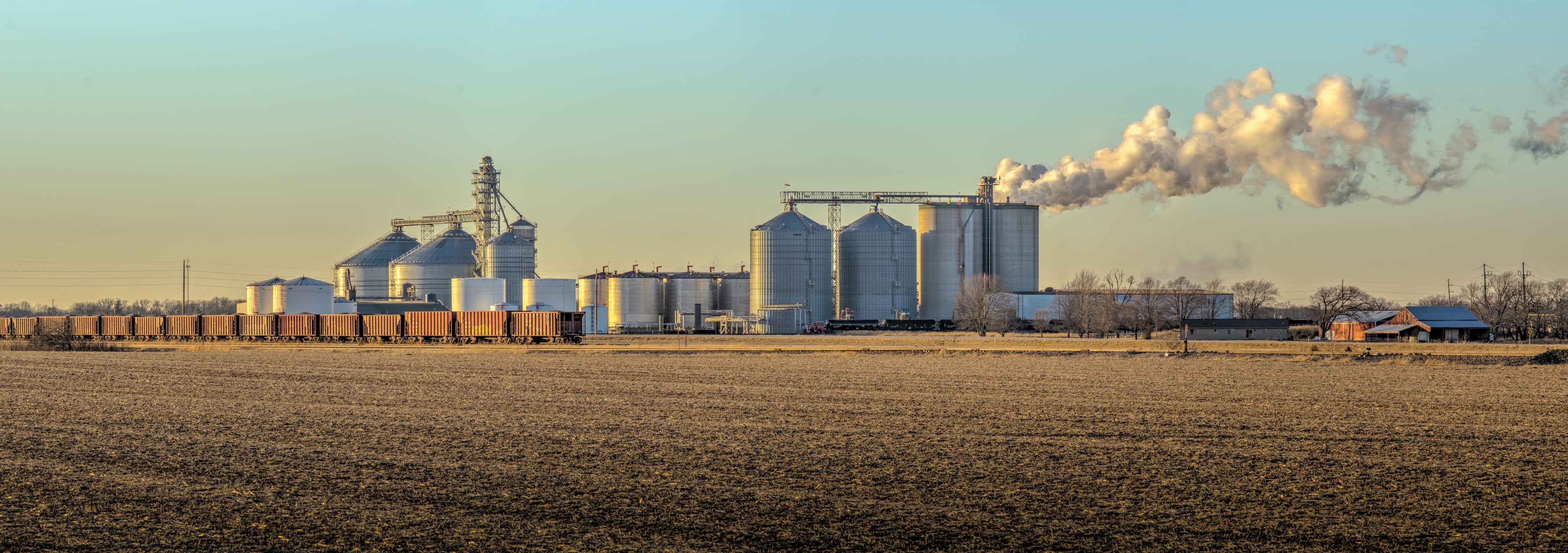 Ethanol plant in an agricultural setting, along a railway